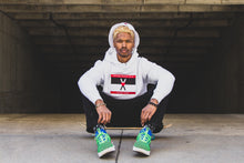 Load image into Gallery viewer, Man wearing white hoodie with red black and red heart-oms flag on the front and center. Man is sitting on skateboard wearing puma shoes and a white heart on my sleeve bucket hat.